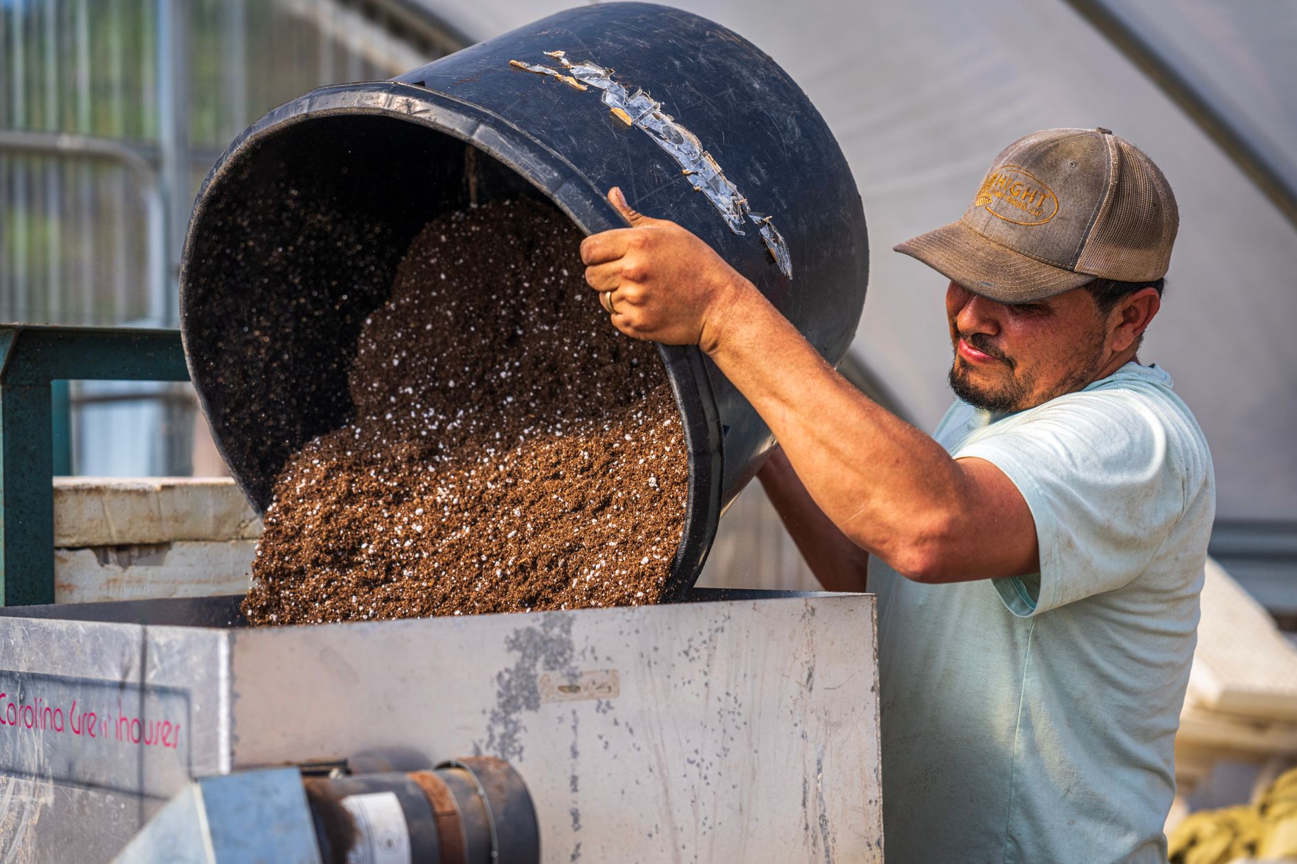 Coco coir bricks and vermiculite in a bucket for mushroom substrate.